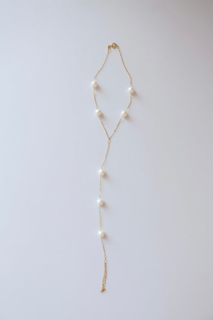 Pearl Glide 18K yellow gold freshwater pearl hand chain handcrafted Dubai